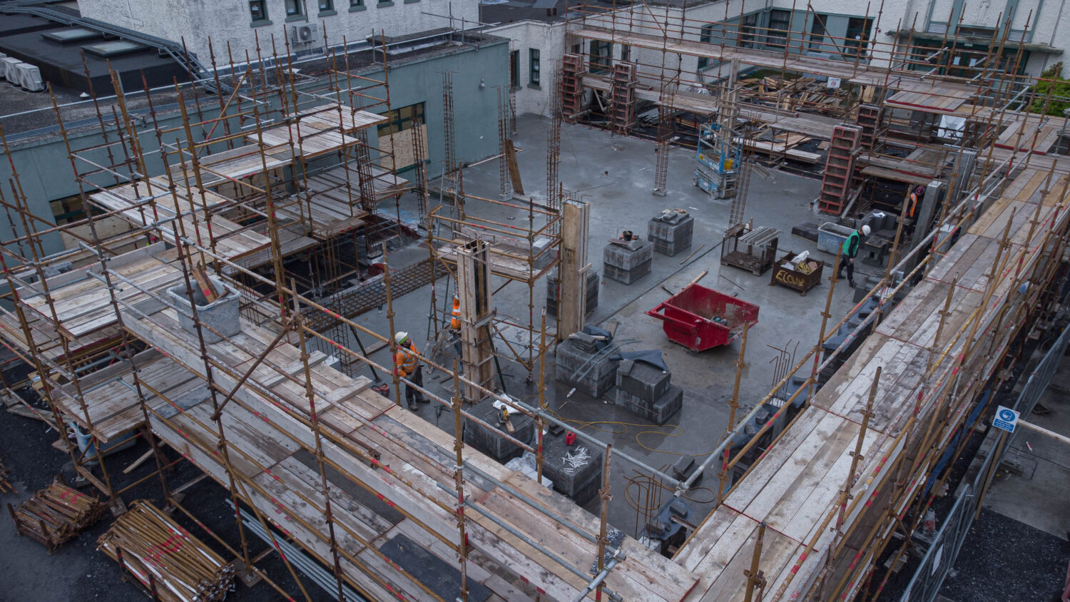 drone shot of workers making concrete forms for pouring